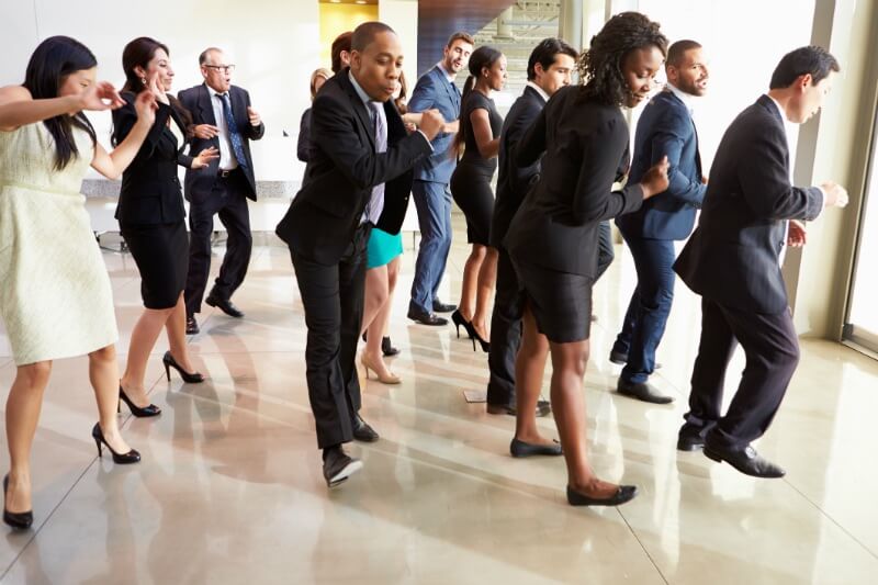 IMG: group of business people dancing