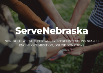 Five hands, gathered in center of image as a sports team does in a huddle. Text: ServeNebraska; nonprofit website, portals, event registrations, search engine optimization, online donations.