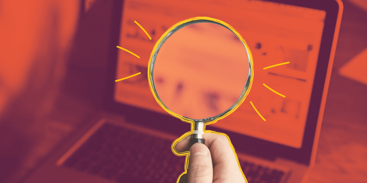 magnifying glass over a laptop screen