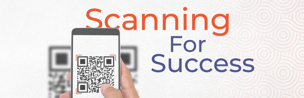 Person holding phone in their right hand, aimed at a QR cod and clicking for the code's link. Words "Scanning for success" are over a very lightly orang and whit textured backgound.