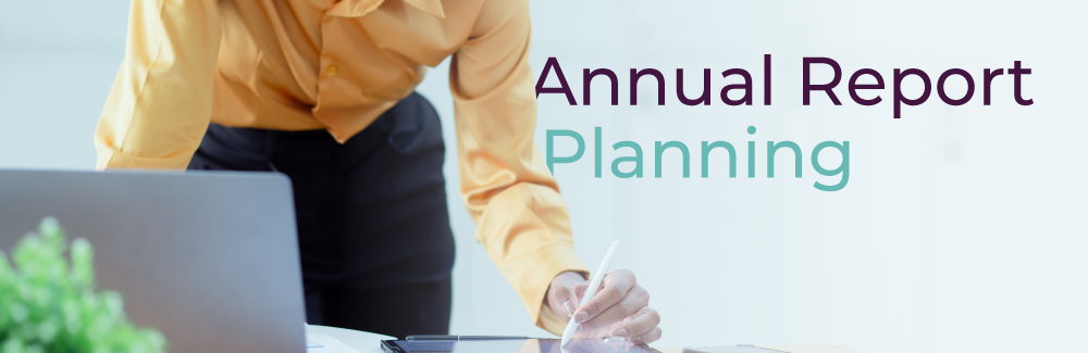 Person leaning over a laptop and a desk writing plans. Text over the photo reads: Annual Report Planning.