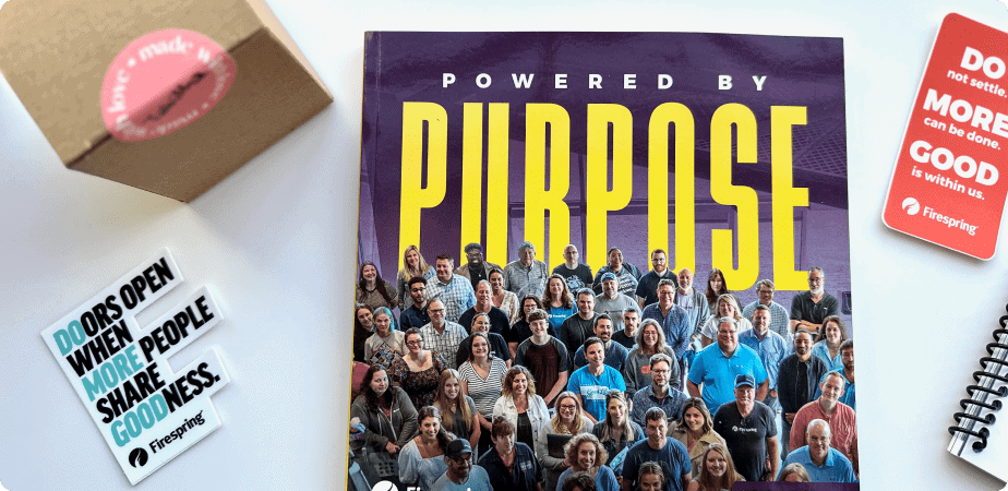 ‘Powered by Purpose’ magazine surrounded by motivational cards and a box.