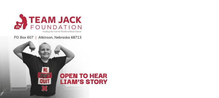 462807-Team_Jack-EOY25_Campaign_Liam_No10_Env_PRINT Smiling child with short hair flexes arms and wears a "We Don't Quit" shirt. Text reads: "Open to hear Liam's story" and "Team Jack Foundation" with address in Atkinson, Nebraska.